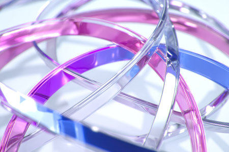 This image presents abstract rings in various shades of blue, pink, and purple. The composition showcases the interplay of light and reflection, highlighting the transparency of the forms. The overall style suggests a modern design, potentially suitable for digital design projects or visual concepts within the realm of technology.の素材