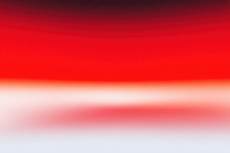 This abstract image features a smooth gradient blending from dark red to white. The color transitions create a sense of depth and visual interest. The simple composition and soft color palette make it versatile for a variety of creative projects, suitable for both commercial and editorial applications.の素材