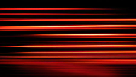 A dynamic composition presents parallel red light streaks against a dark backdrop, creating a sense of movement. The artwork uses bold colors and a linear design, evoking energy and speed. It has potential uses in various commercial projects, including website design and graphic illustrations. The background is black.の素材