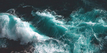 An aerial perspective captures dynamic ocean waves in a teal and white palette. The water's textured surface contrasts with dark depths, indicative of an outdoor environment. This image is suitable for various commercial purposes, including use in advertising, web design, or editorial content.の素材