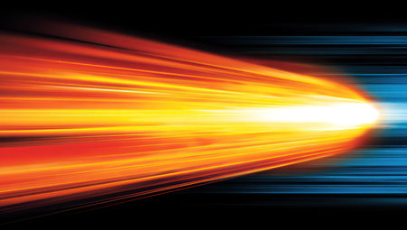 This image features a vibrant display of abstract energy. Streaks of fiery orange and cool blue light emanate from a central point, set against a dark background. The composition emphasizes speed and motion. Ideal for use in projects related to technology, energy, or design, this visual offers creative flexibility.の素材