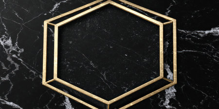 A gold-colored geometric frame is presented against a black marble background. The image displays high-contrast lighting emphasizing the texture of the stone and the form of the frame. This versatile visual could be suitable for various design applications, including graphic design and marketing materials.の素材