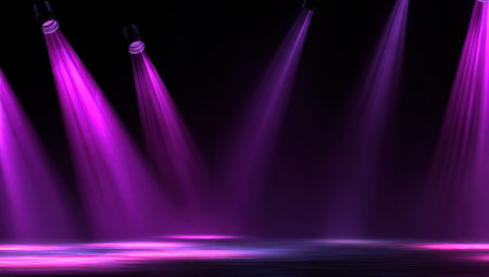 Stage illuminated by vibrant purple spotlights against a dark backdropの素材