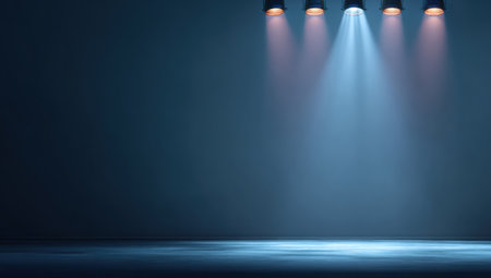 Empty stage backdrop with a spotlight illuminating the center against a dark backgroundの素材