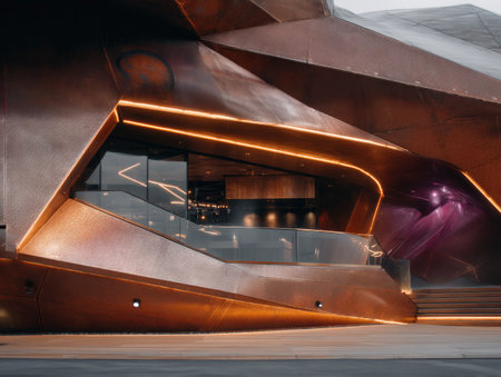 Futuristic, geometric building with copper exterior, featuring lit edges, a glass facade, and stairsの素材