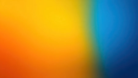 Vibrant, blurry color gradient transitions from warm orange to cool blue with yellowの素材