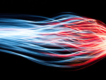 Abstract flowing streams of light, red and blue hues against a black background, dynamic artの素材