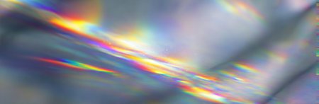 Abstract image with refracted light, showcasing rainbow-colored streaks against a gradient backdropの素材