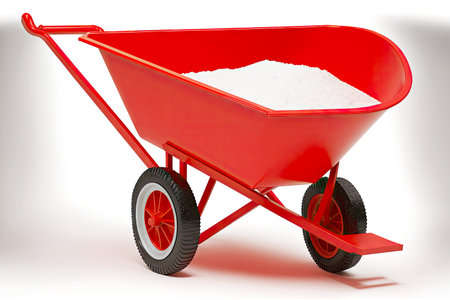 red metal work wheelbarrow insulated on white backgroundの写真素材