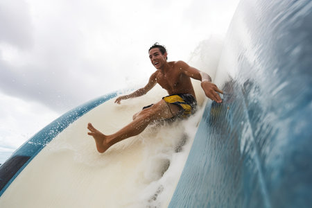 person, riding down the ultimate water slide, with rush of water and wind in their face, created with generative aiの素材
