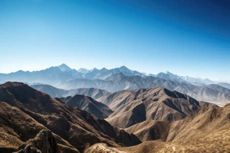 majestic mountain range surrounded by clear blue skies, created with generative aiの素材