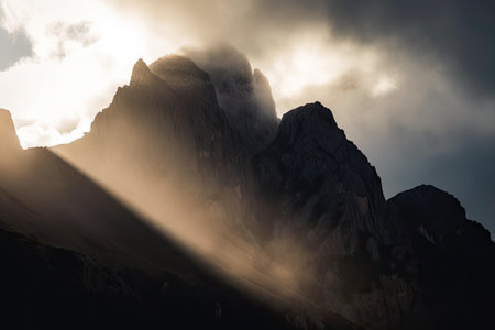 close-up of towering mountain, with clouds and sun peeking through the peaks, created with generative aiの素材