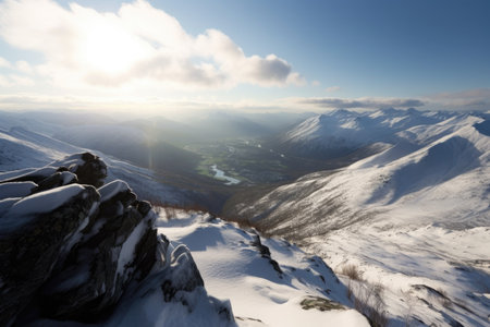 snowy mountaintop, with view of sunlit valley below, and surrounding peaks in the distance, created with generative aiの素材