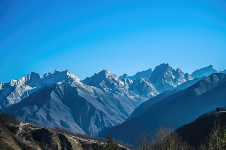 majestic mountain range surrounded by clear blue skies, created with generative aiの素材