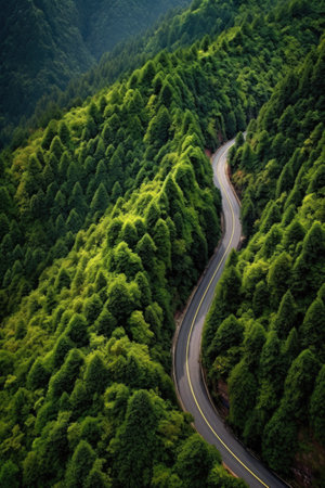 aerial view of winding mountain road through the trees, created with generative aiの素材