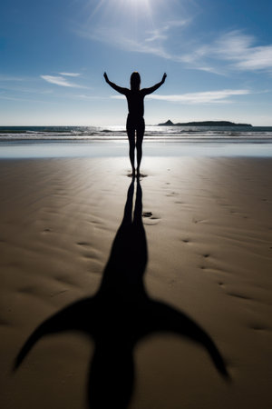 shadow of a woman practicing yoga on the beach, created with generative aiの素材