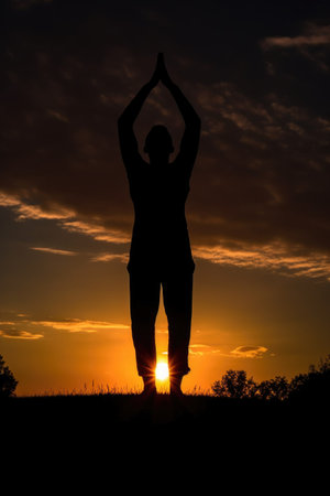 silhouette of a yoga pose against a sunset backdrop, created with generative aiの素材