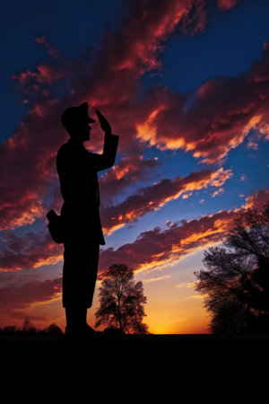silhouette of a saluting soldier against a sunset sky, created with generative aiの素材