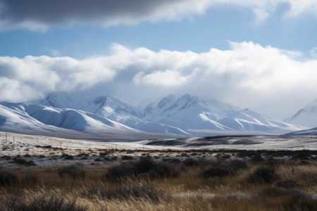 view of snow-covered mountain range, with clouds and sky in the background, created with generative aiの素材
