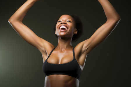 portrait of a young woman with her arms raised showing off her sports bra, created with generative aiの素材