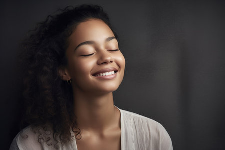 shot of an attractive young woman smiling with her eyes closed, created with generative aiの素材