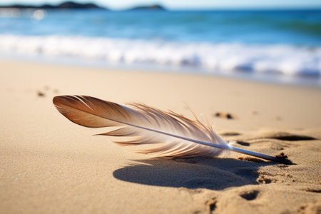 a single feather lying on a sandy beach, created with generative aiの素材