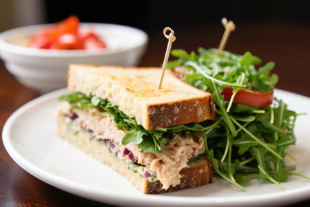tuna mayo sandwich with mixed microgreen salad at side, created with generative aiの素材