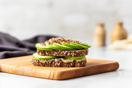 whole grain bread topped with avocado slices and sesame seeds, created with generative aiの素材