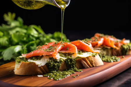 drizzling pesto over a smoked salmon bruschetta, created with generative aiの素材