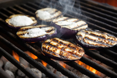 eggplants with charring marks on a grill, white smoke around, created with generative aiの素材
