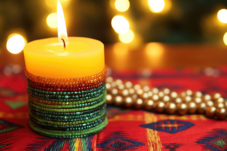close up shot of a lit kwanzaa candle in a kinara, created with generative aiの素材
