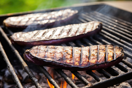 eggplants with charring marks on a grill, white smoke around, created with generative aiの素材