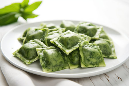 fresh spinach ravioli pasta overlapped on a white ceramic plate, created with generative aiの素材