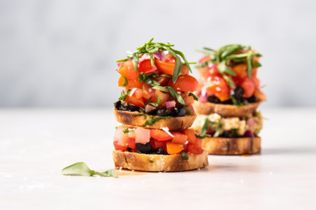 trio of bruschettas stacked vertically on a minimalist background, created with generative aiの素材