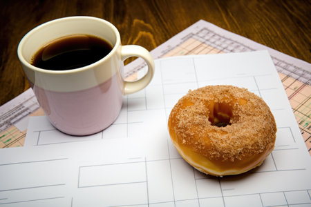 coffee cup and doughnut on a sheet of budget planning, created with generative aiの素材