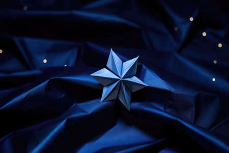 origami star nestled amid dark blue craft paper to mimic night sky, created with generative aiの素材