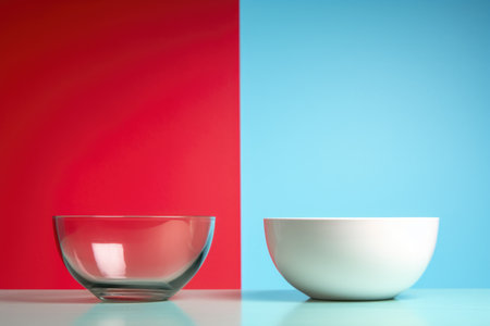 an empty bowl next to a filled one against differing backgrounds, created with generative aiの素材