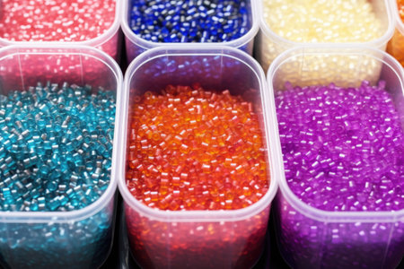 colorful beads sorted in plastic containers, created with generative aiの素材