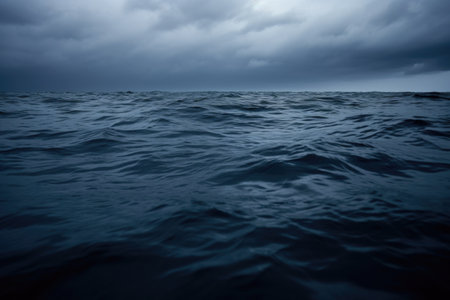 ocean surface under a grey cloud, created with generative aiの素材