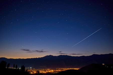 perseid meteor shower over a silhouetted mountain range, created with generative aiの素材
