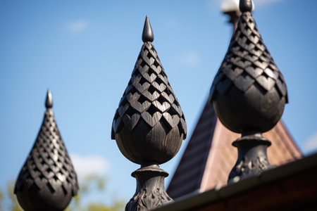 a closeup shot of carved wooden finials on gothic roof, created with generative aiの素材