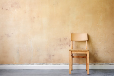 unfinished wooden chair against wall, created with generative aiの素材