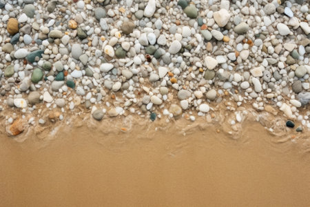 a closeup of a sandy beach with small stones, created with generative aiの素材