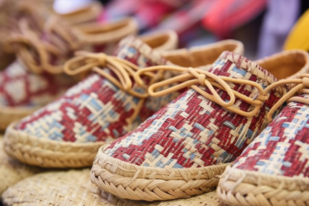 close-up of woven straw footwear from a highland village, created with generative aiの素材