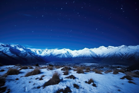 snow-capped mountains under deep blue night sky, created with generative aiの素材