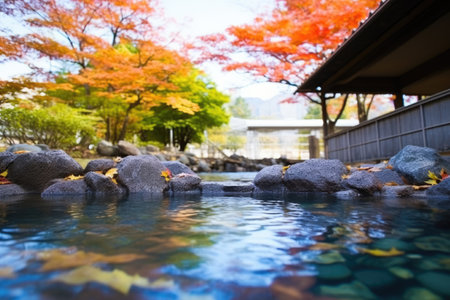 hot spring with fall maple leaves floating on it, created with generative aiの素材