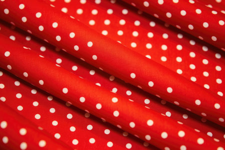 red synthetic fabric with polka dot patterns, created with generative aiの素材