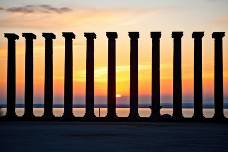 cluster of ancient columns silhouetted against the horizon, created with generative aiの素材