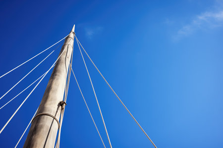close-up of sailboat mast against clear blue sky, created with generative aiの素材