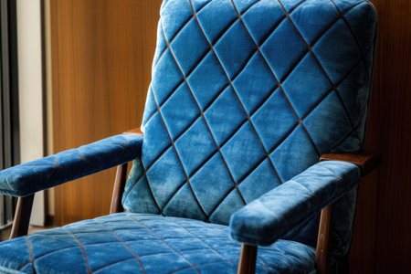 detailed shot of a vintage scandinavian armchair with blue upholstery, created with generative aiの素材